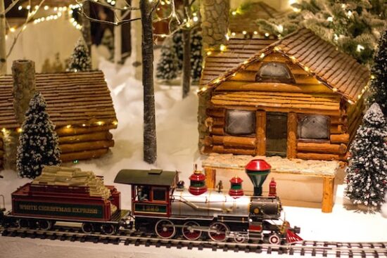 A Christmas Carol by Charles Dickens multicolored train toy near house