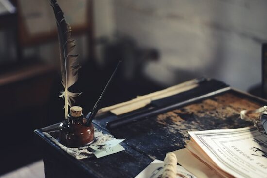 The Pickwick Papers by Charles Dickens ink bottle on desk